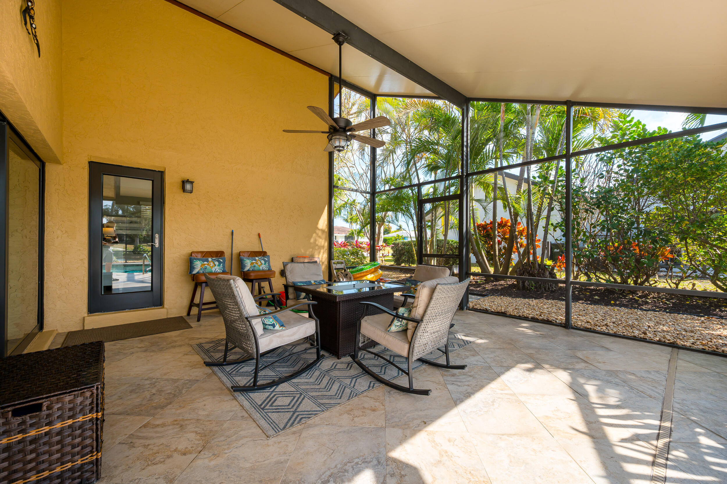 3250 Lakeview Boulevard Delray Beach, FL 33445 - Photo 22 of 26 a living room with furniture and a floor to ceiling window