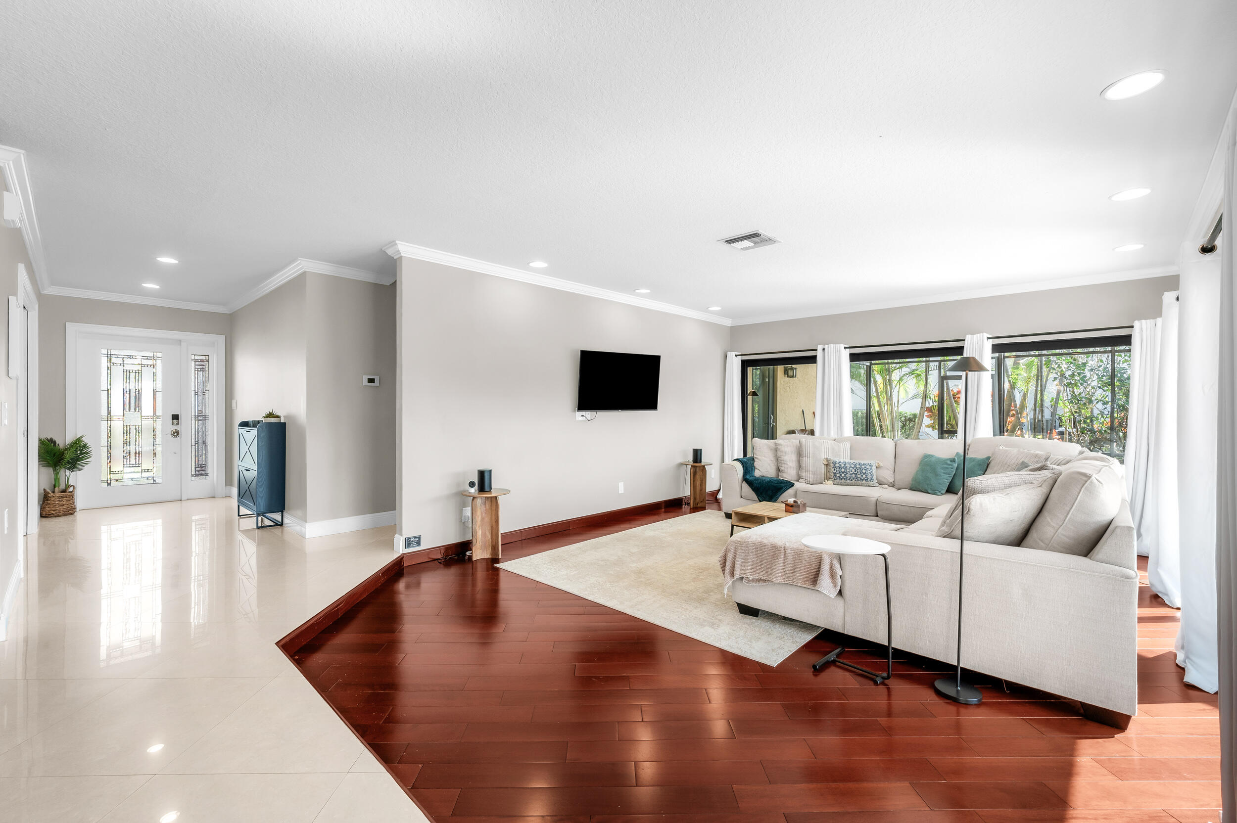 3250 Lakeview Boulevard Delray Beach, FL 33445 - Photo 5 of 26 a living room with furniture and a flat screen tv