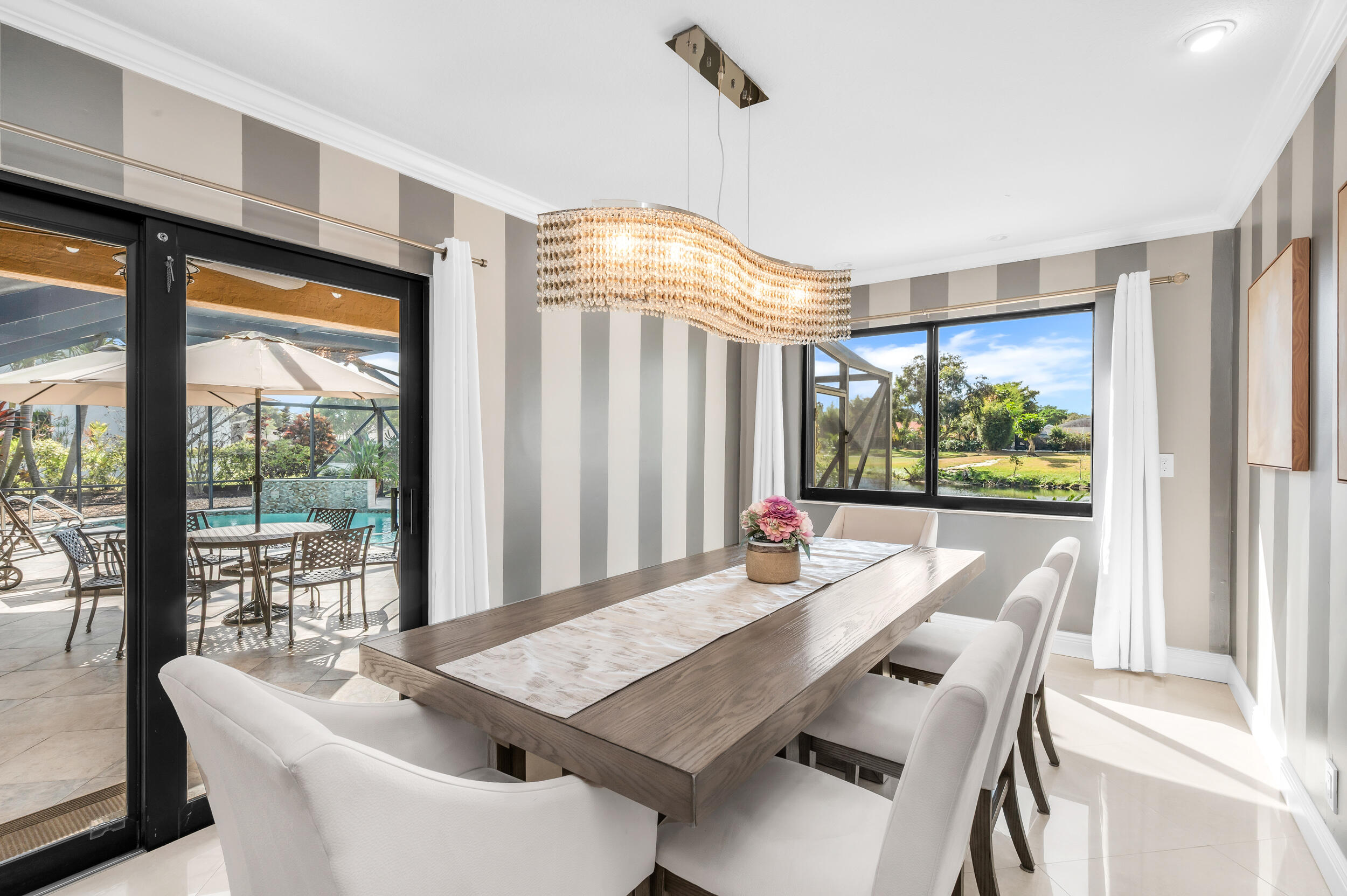 3250 Lakeview Boulevard Delray Beach, FL 33445 - Photo 10 of 26 a view of a dining room with furniture window and outside view