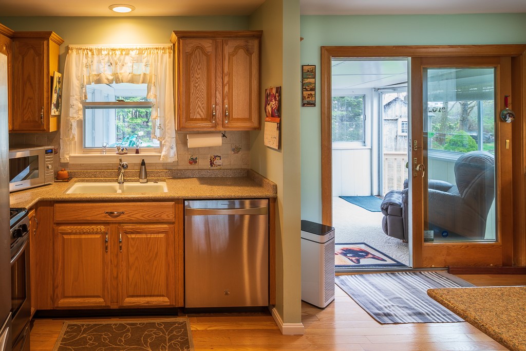 5 Barton Lane Middletown, RI 02842 - Photo 17 of 36 Kitchen with slider to sunroom