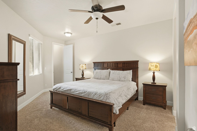 4269 Razor Drive Washington, UT 84780 - Photo 6 of 50 Bedroom featuring ceiling fan and light colored carpet