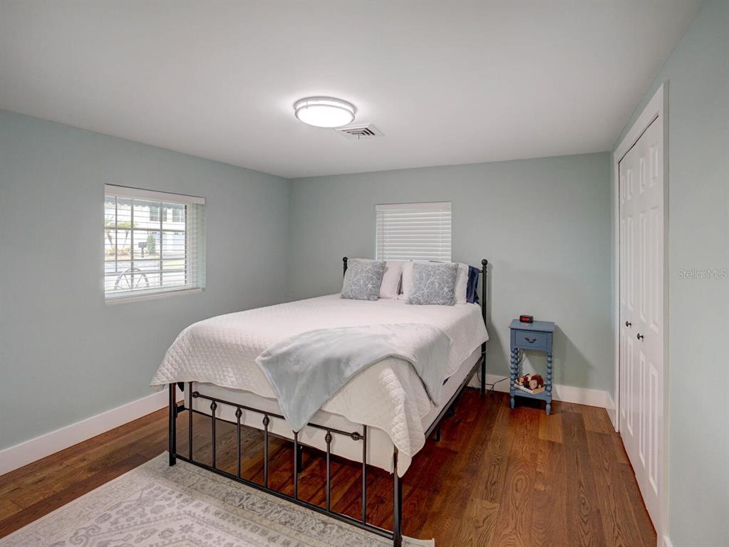 6746 River Road New Port Richey, FL 34652 - Photo 20 of 55 a bedroom with a bed and windows