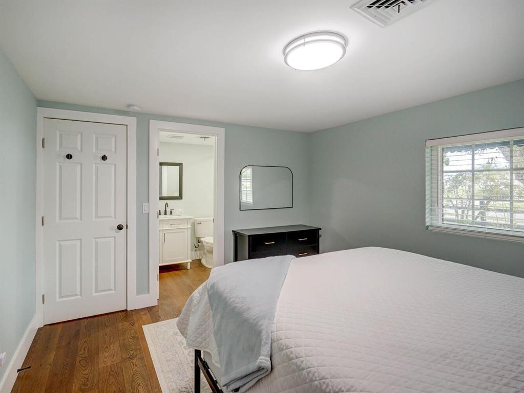 6746 River Road New Port Richey, FL 34652 - Photo 21 of 55 a bedroom with a bed and a window