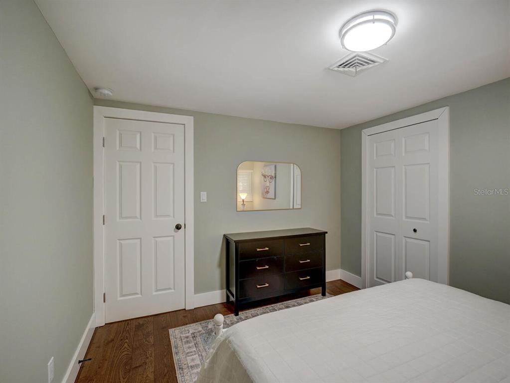 6746 River Road New Port Richey, FL 34652 - Photo 26 of 55 a bedroom with a bed and a lamp