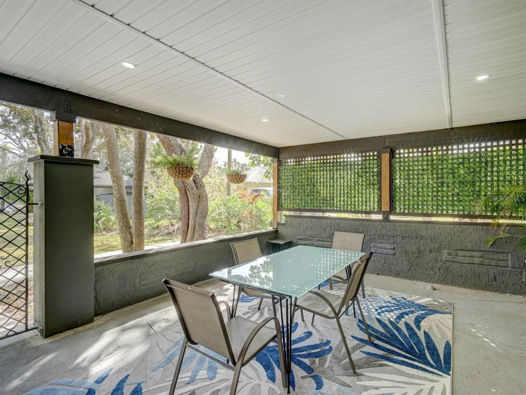 6746 River Road New Port Richey, FL 34652 - Photo 28 of 55 a view of a dining room with furniture window and outside view