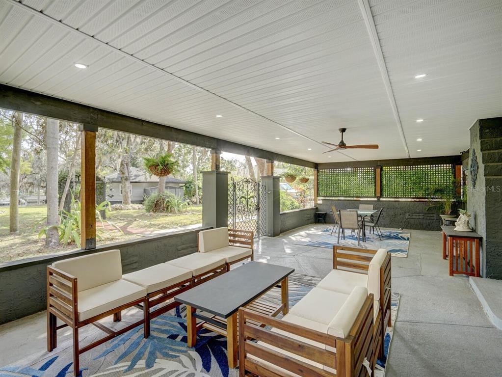 6746 River Road New Port Richey, FL 34652 - Photo 31 of 55 a outdoor space with lots of furniture and large windows