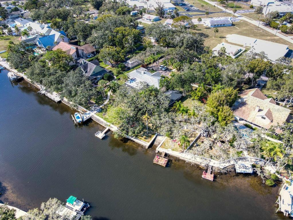 6746 River Road New Port Richey, FL 34652 - Photo 4 of 55 an aerial view of a house with a yard swimming pool and outdoor seating