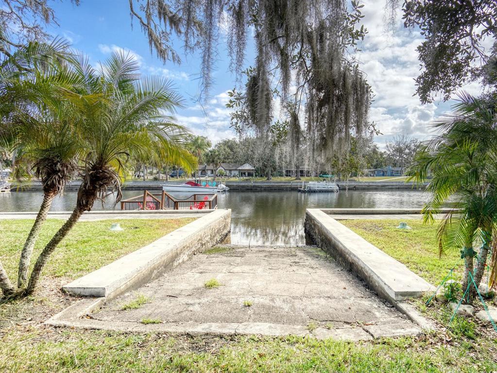 6746 River Road New Port Richey, FL 34652 - Photo 43 of 55 a view of a swimming pool with a lake view