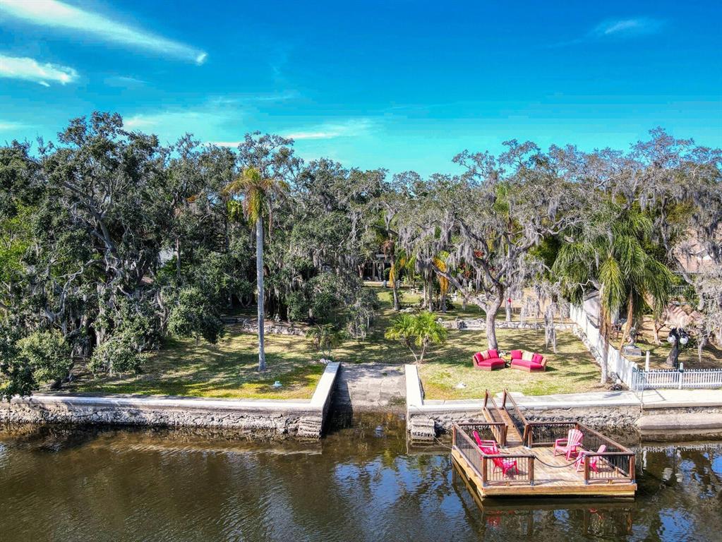 6746 River Road New Port Richey, FL 34652 - Photo 5 of 55 a view of a swimming pool with sitting area