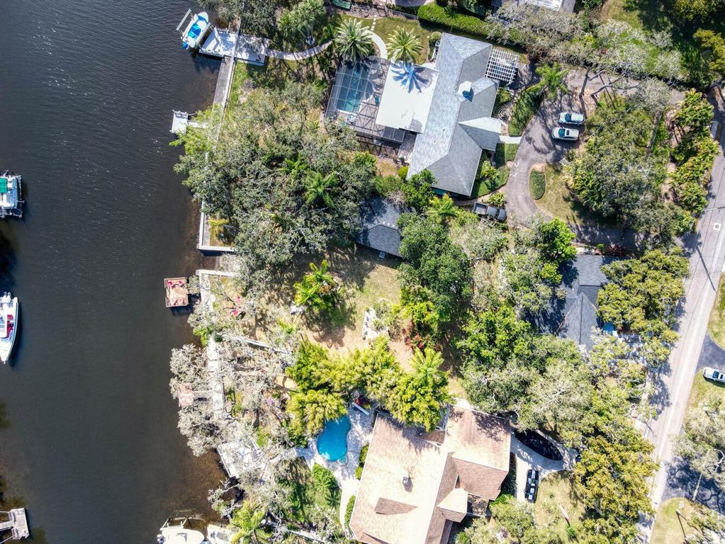 6746 River Road New Port Richey, FL 34652 - Photo 53 of 55 an aerial view of a house with a yard and garden