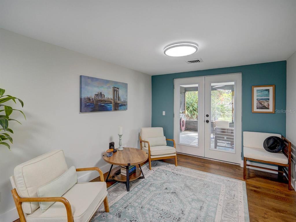 6746 River Road New Port Richey, FL 34652 - Photo 8 of 55 a living room with furniture and a window