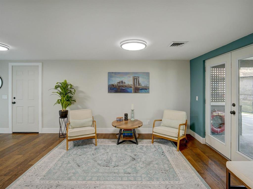 6746 River Road New Port Richey, FL 34652 - Photo 10 of 55 a living room with furniture and a potted plant