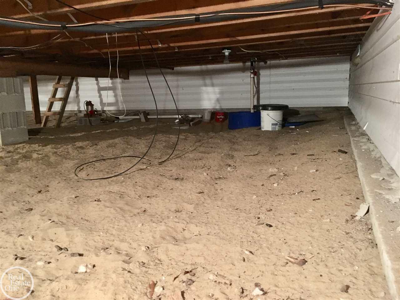 6044 Port Austin Road Caseville, MI 48725 - Photo 45 of 47 Outside or inside access to the deep crawl space with sump system to keep it dry all year long.