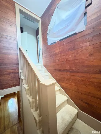 a view of balcony with wooden floor