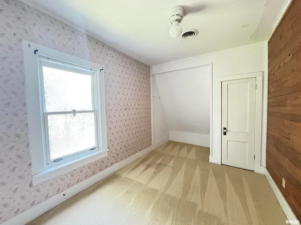 a view of an empty room and window