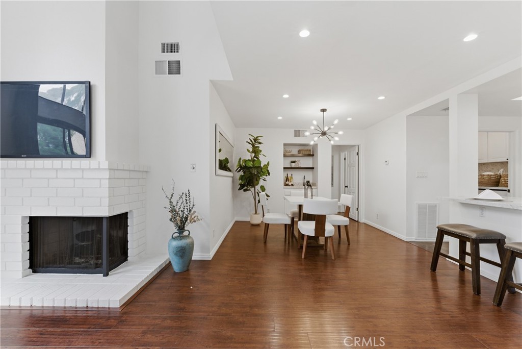 8180 Manitoba Street, Unit 330 Playa del Rey, CA 90293 - Photo 6 of 31 a view of a dining room with furniture and wooden floor