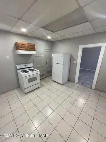 a view of kitchen and utility room