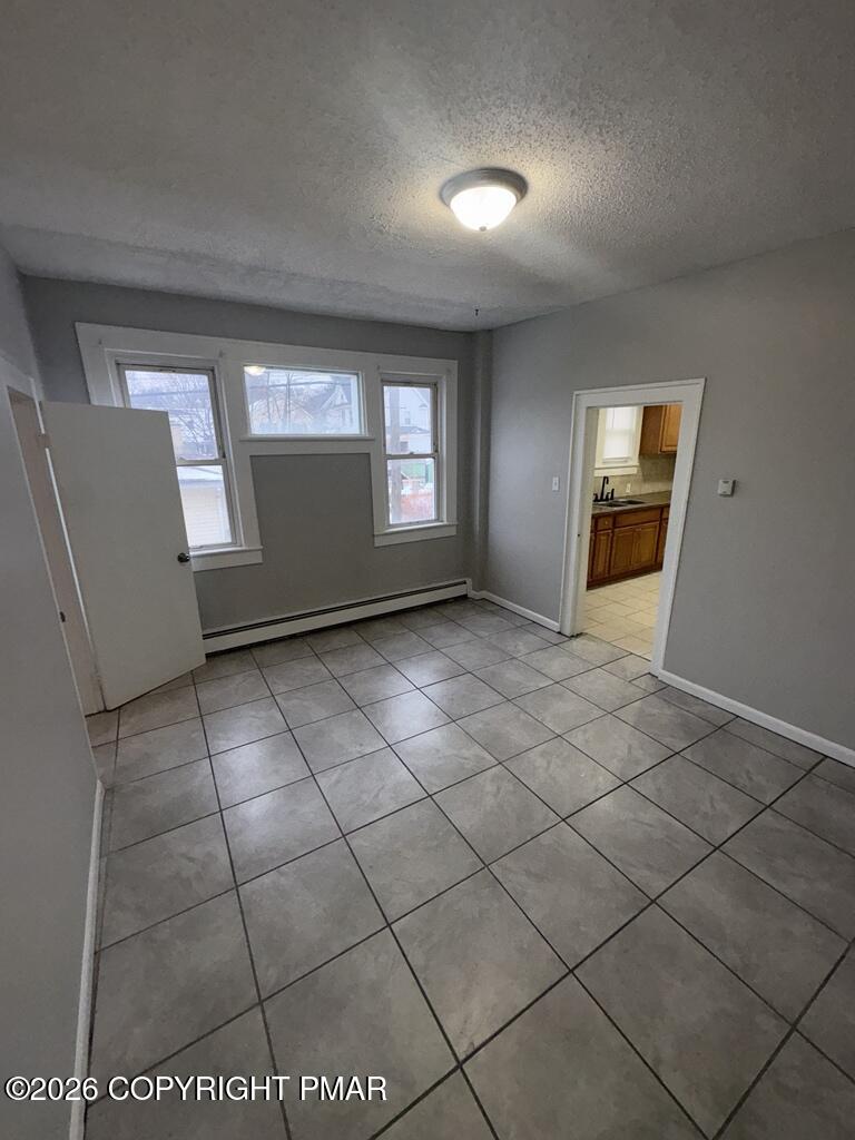 532 Cherry Street, Unit D Scranton, PA 18505 - Photo 22 of 26 an empty room with windows