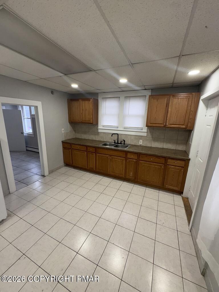532 Cherry Street, Unit D Scranton, PA 18505 - Photo 5 of 26 a large kitchen with a stove a sink dishwasher and a refrigerator