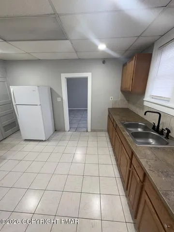 a kitchen with a sink and a stove