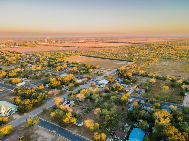 an aerial view of residential building and lake