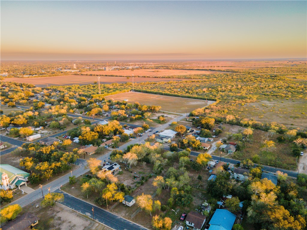 an aerial view of residential building and lake