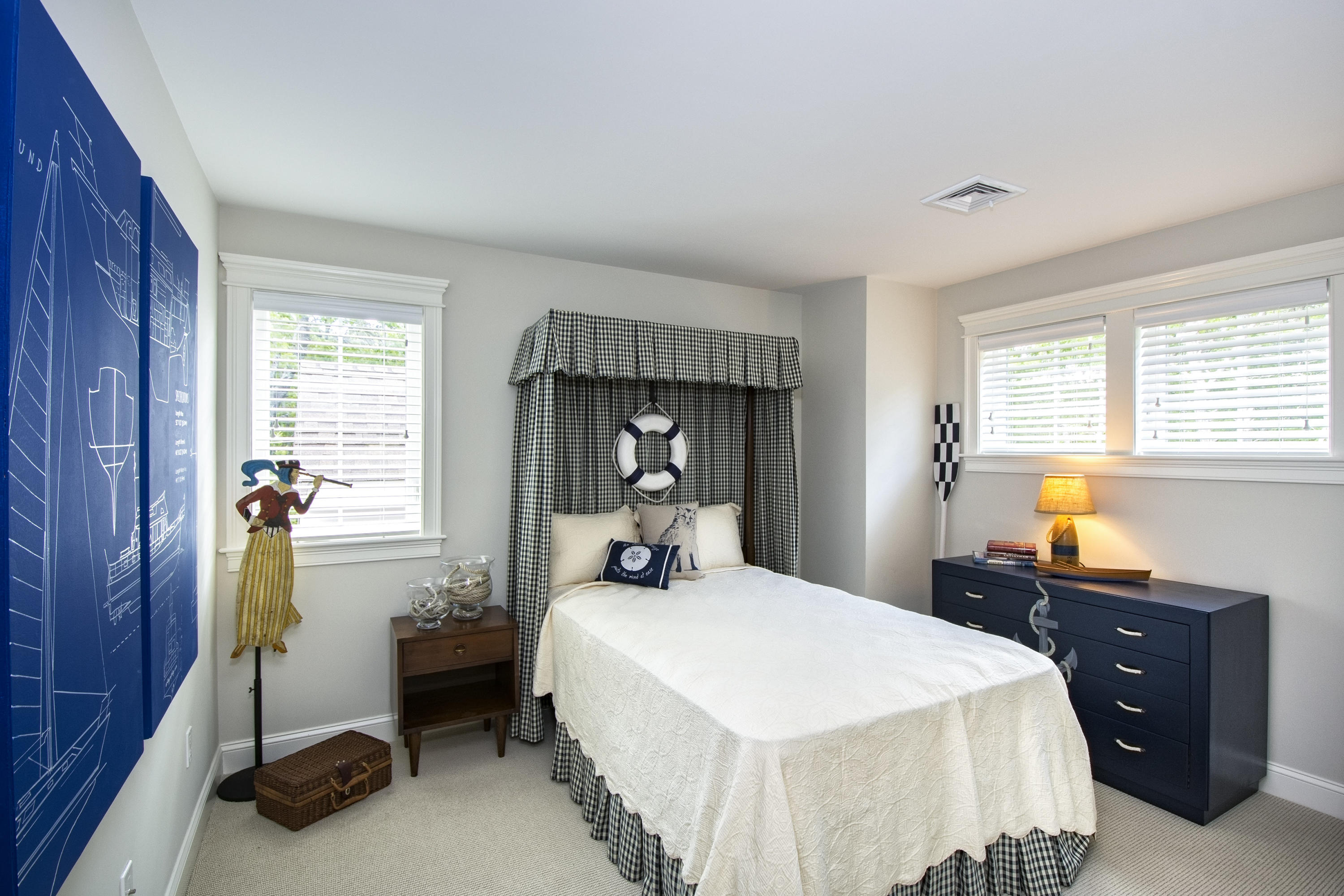 22 Cobblestone Circle Mashpee, MA 02649 - Photo 19 of 34 a bedroom with a bed and a tv on dresser
