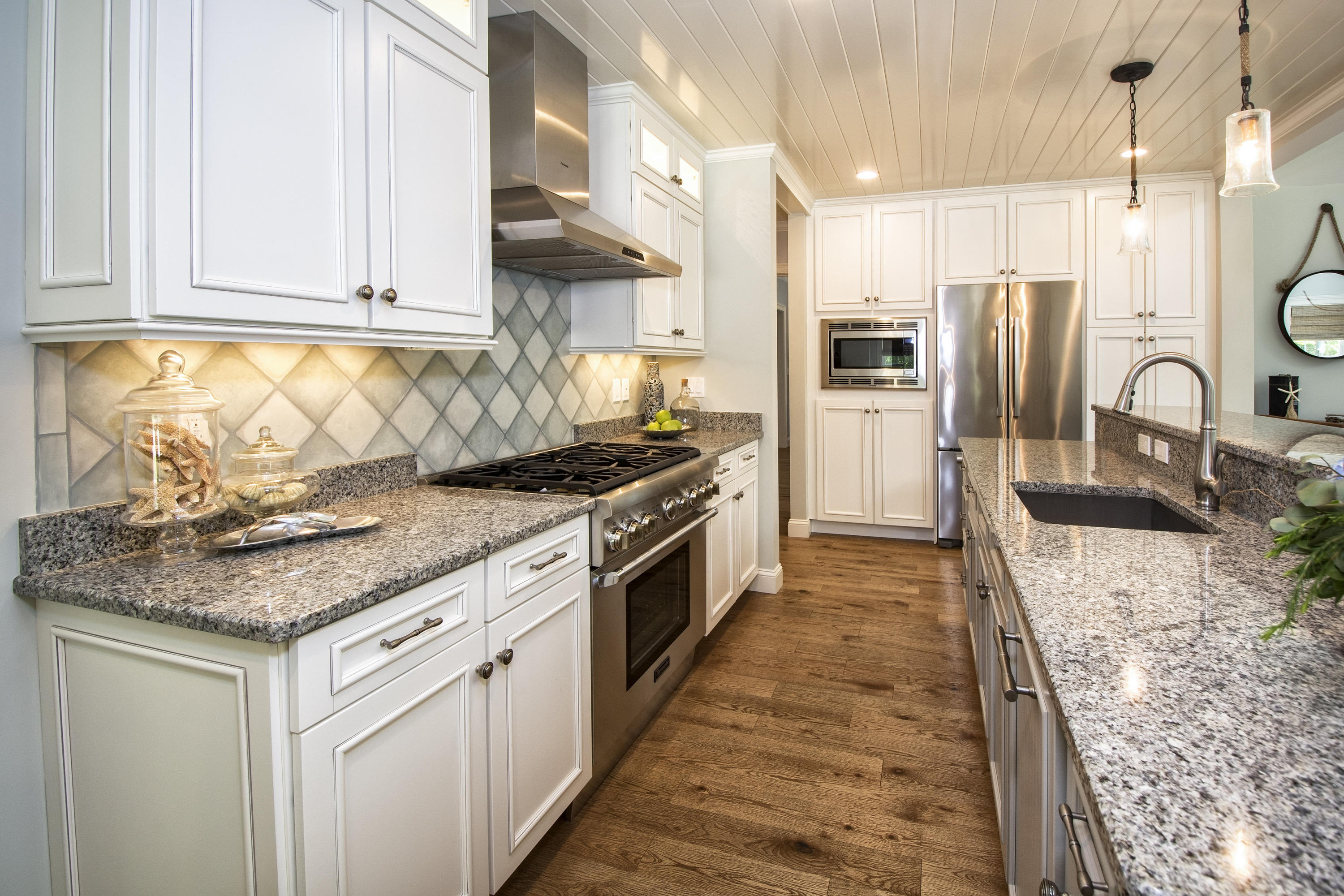 22 Cobblestone Circle Mashpee, MA 02649 - Photo 10 of 34 a kitchen with stainless steel appliances granite countertop a stove a sink and a refrigerator