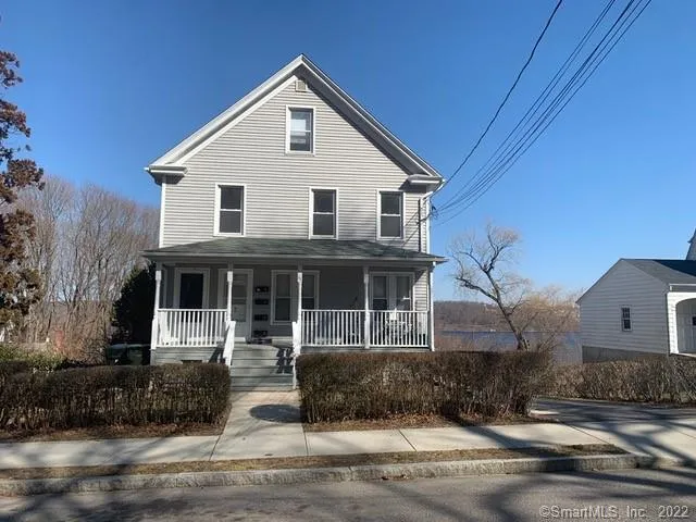 a front view of a house with garage