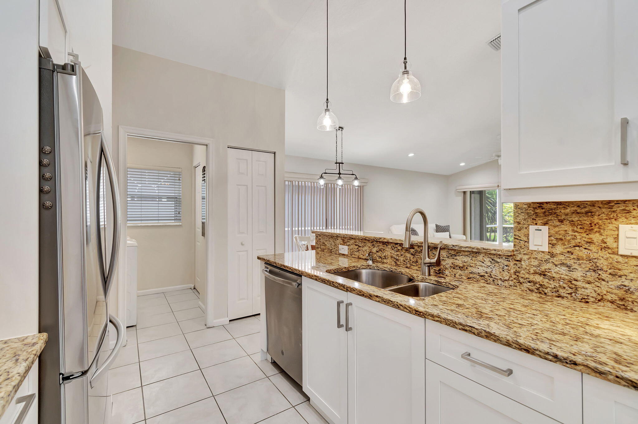 7445 Chorale Road Boynton Beach, FL 33437 - Photo 21 of 28 Kitchen & Laundry