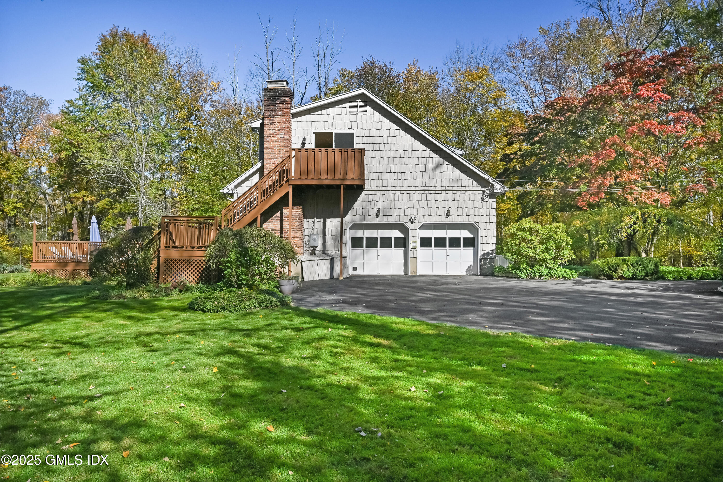 38 Bedford Road Greenwich, CT 06831 - Photo 23 of 32 a view of a house with a big yard plants and large trees