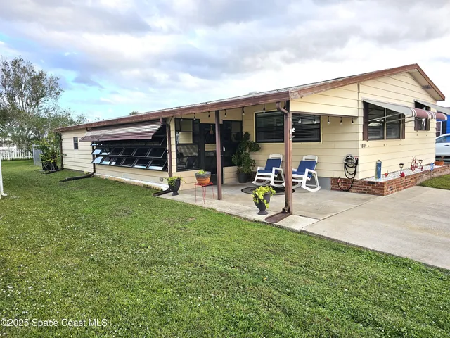 a view of a backyard with a patio