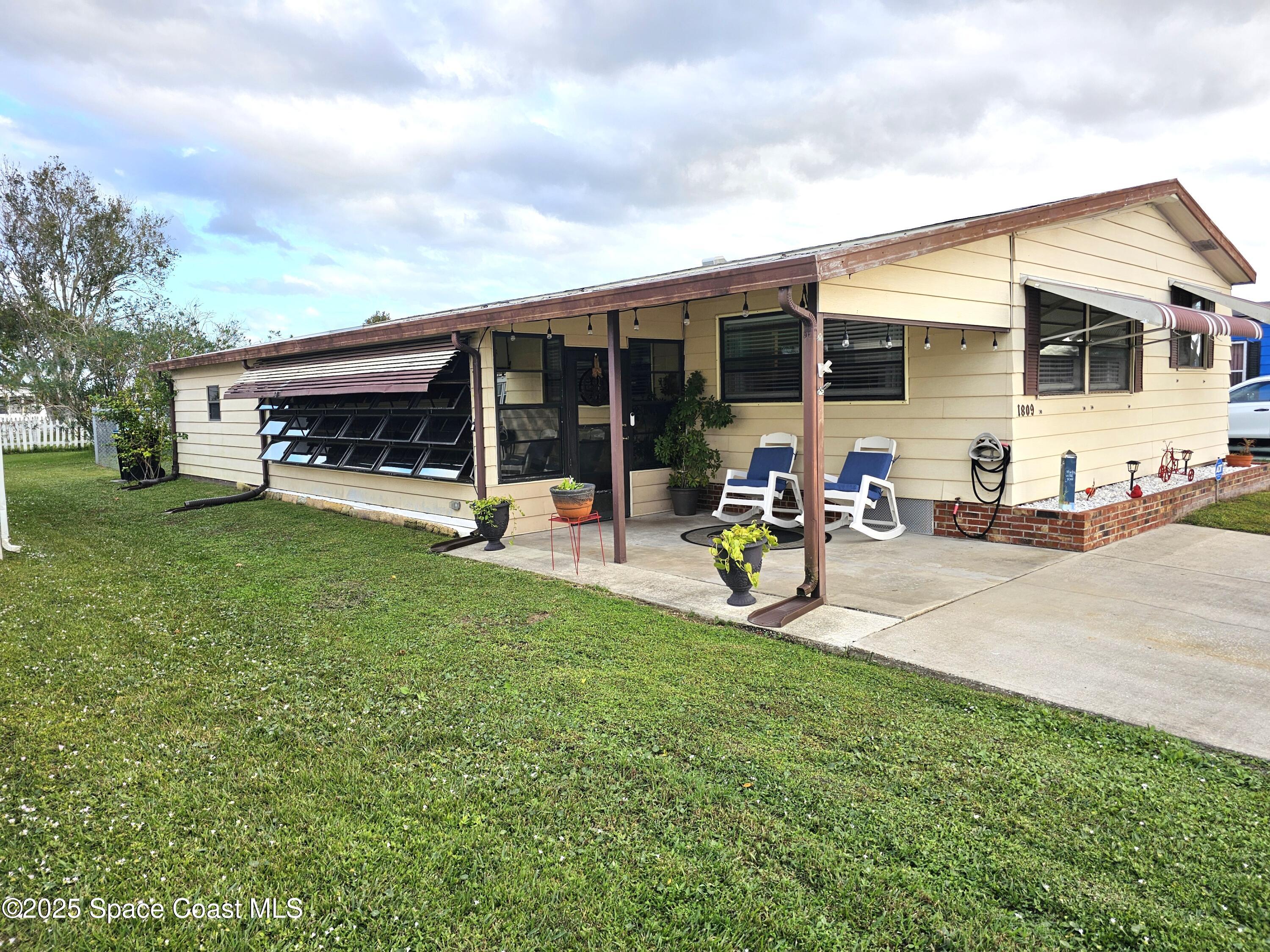 a view of a backyard with a patio