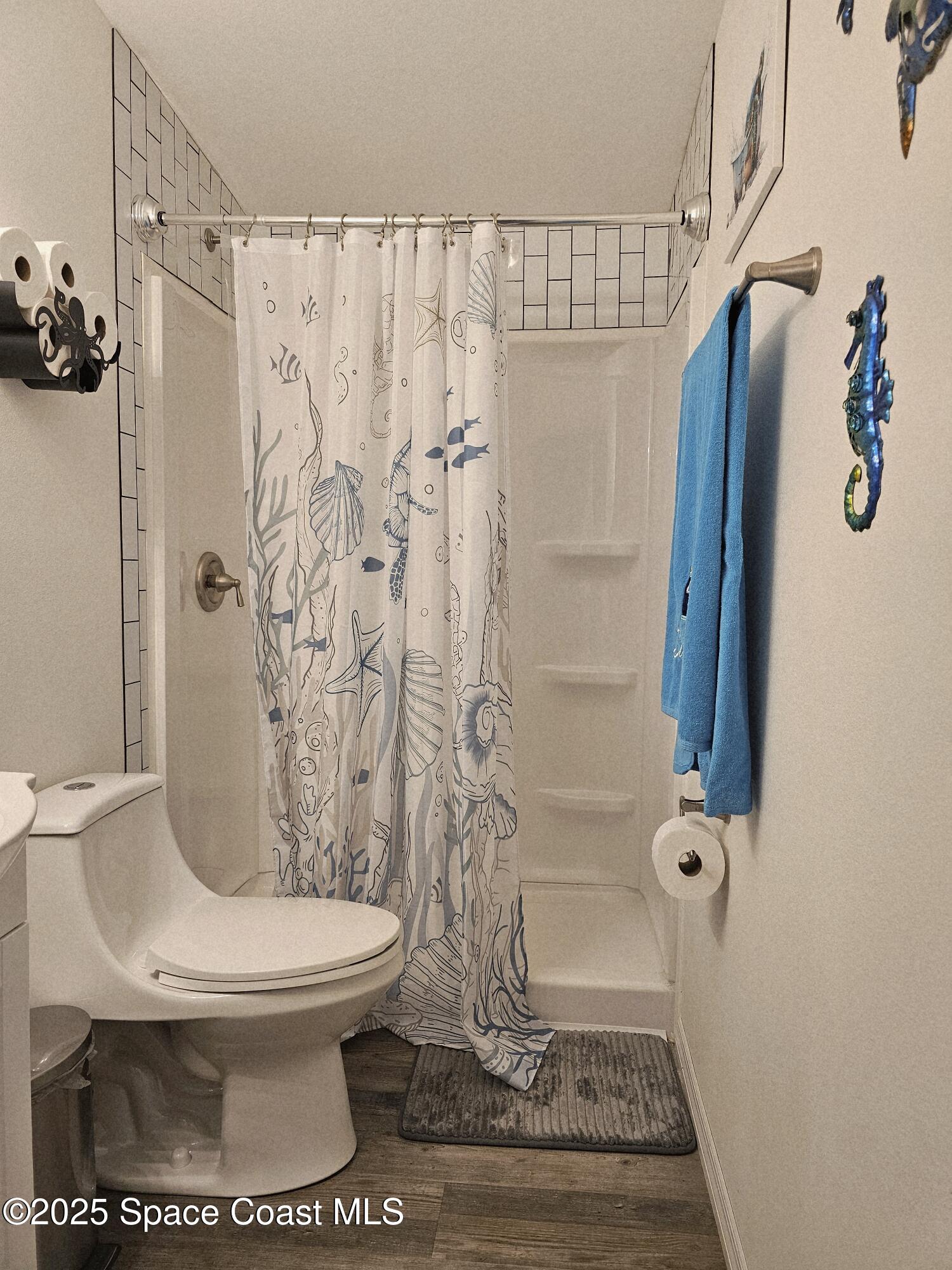 1809 Mango Street Northeast Palm Bay, FL 32905 - Photo 19 of 35 a bathroom with a toilet and shower