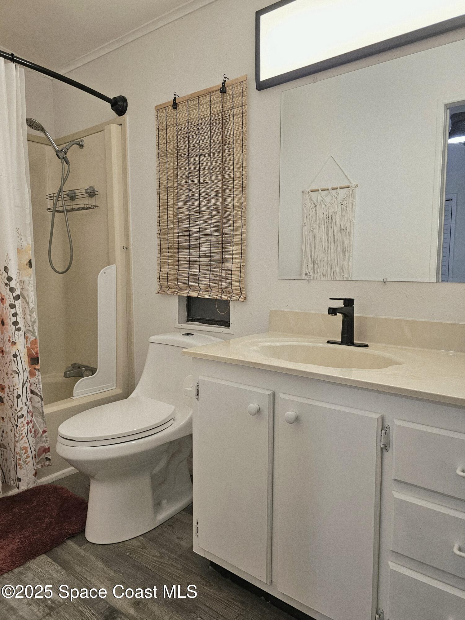 1809 Mango Street Northeast Palm Bay, FL 32905 - Photo 26 of 35 a bathroom with a sink toilet and shower