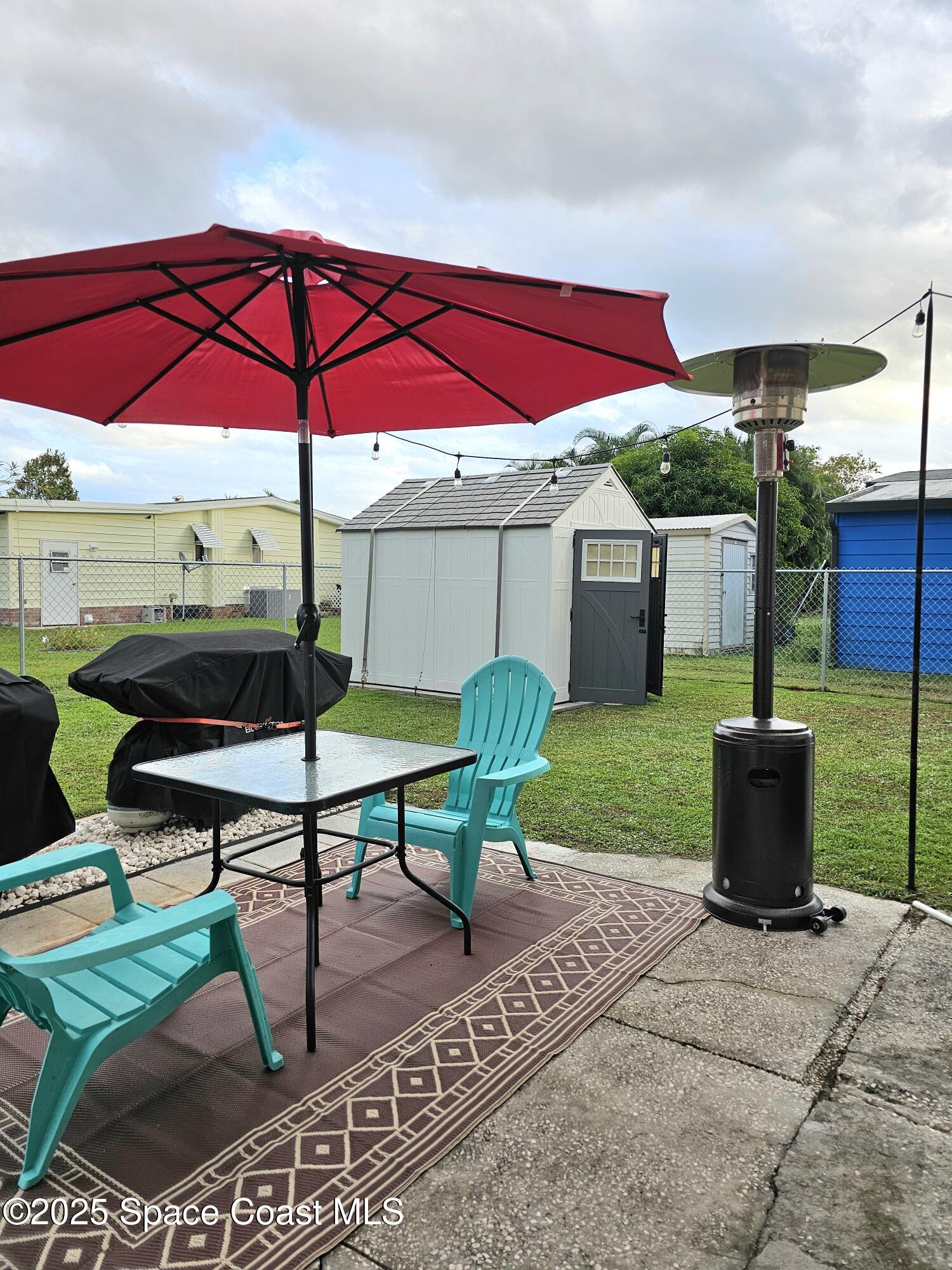 1809 Mango Street Northeast Palm Bay, FL 32905 - Photo 33 of 35 a view of yard with outdoor seating