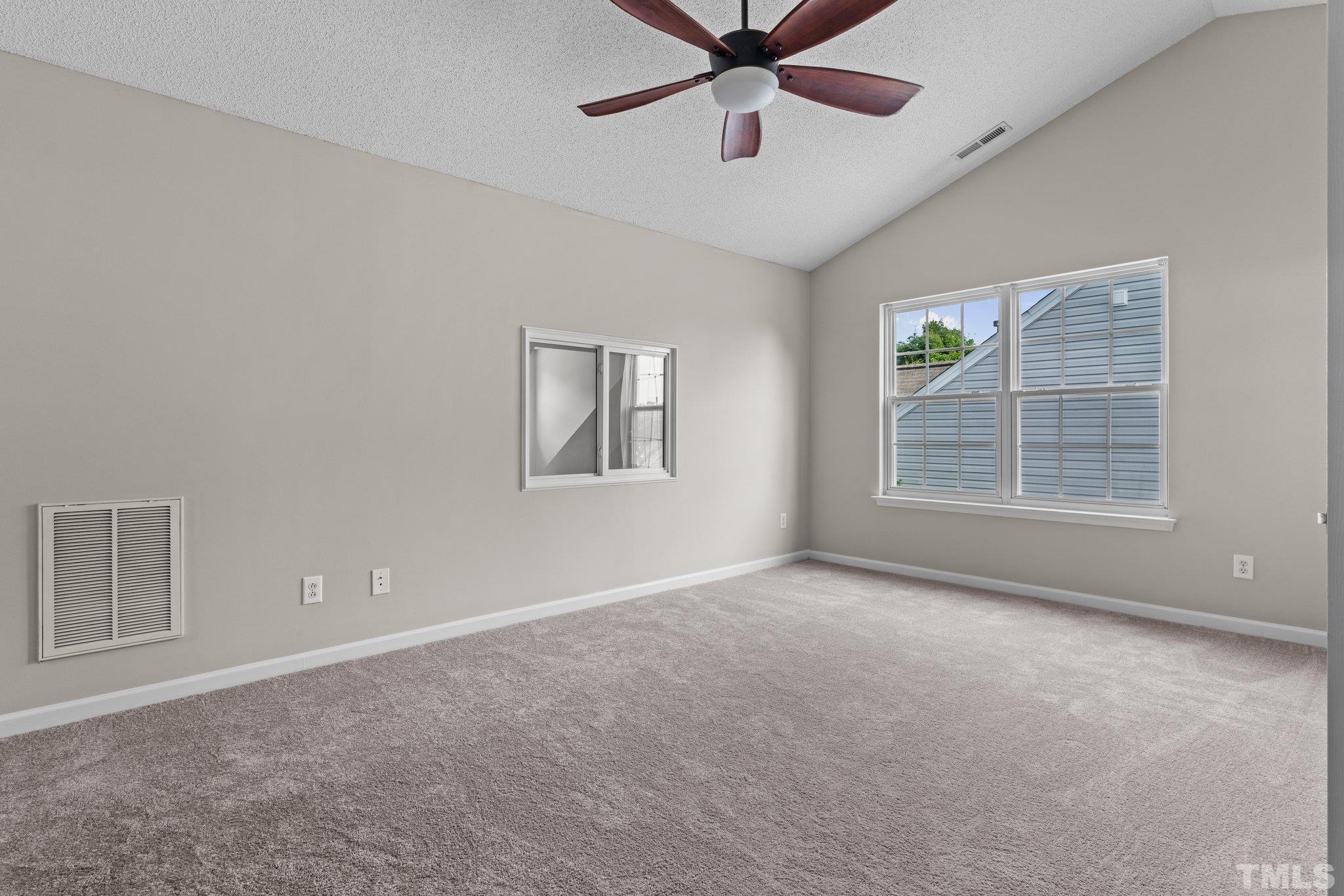 9136 Colony Village Lane Raleigh, NC 27617 - Photo 12 of 17 an empty room with windows and fan