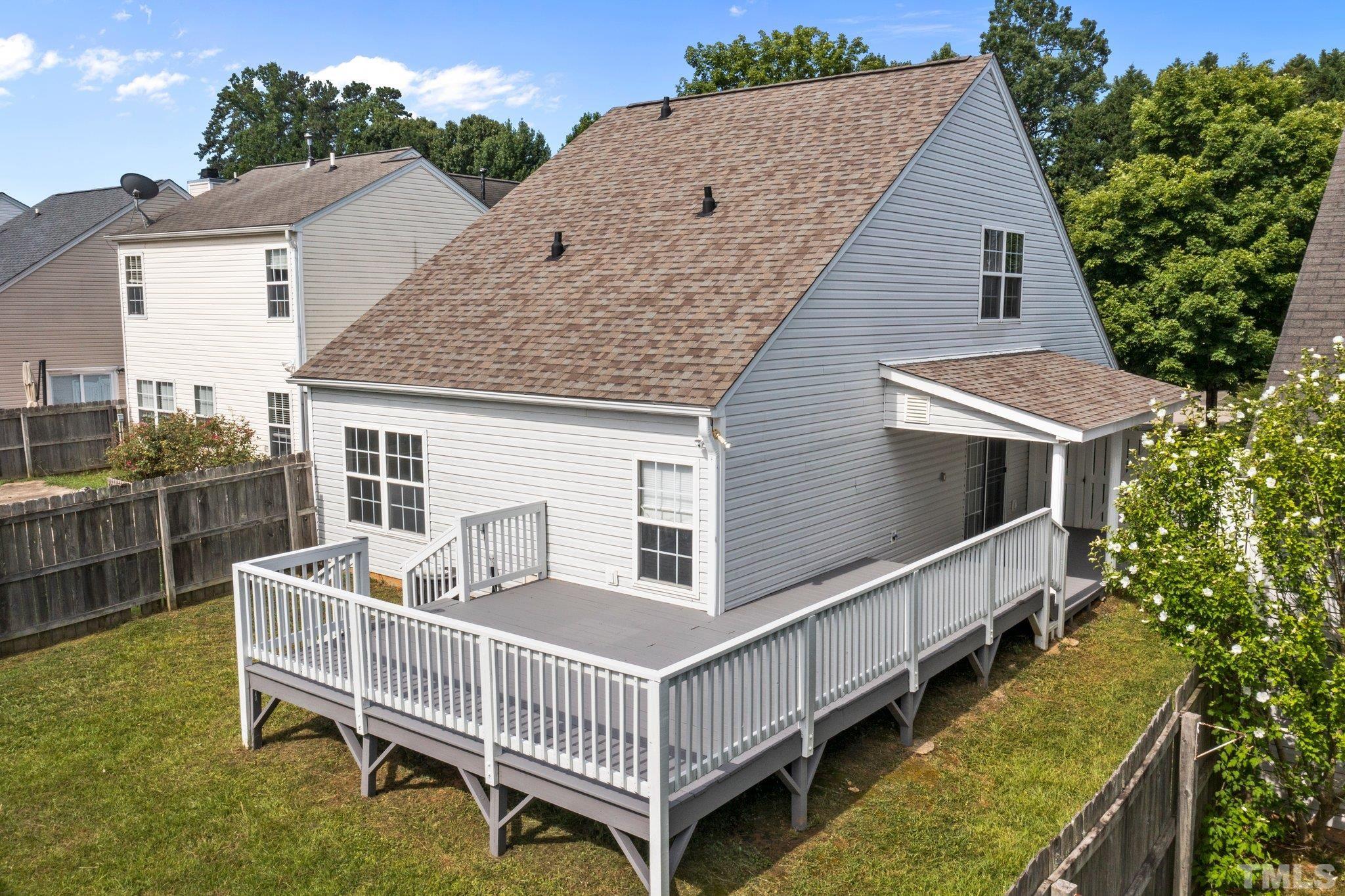 9136 Colony Village Lane Raleigh, NC 27617 - Photo 15 of 17 a view of a house with a yard and deck