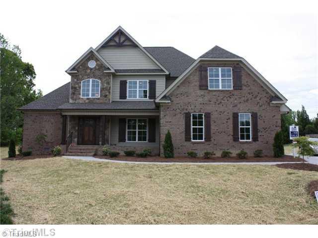 Exterior Front. This beautiful new home was recently completed just in time for the Spring Parade of Homes.  It was a crowd favorite on the tour!