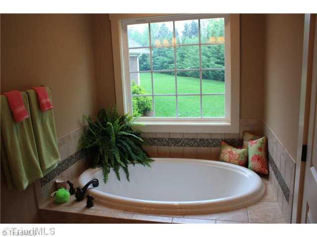 8906 West Pepper Court Oak Ridge, NC 27310 - Photo 11 of 16 Master Bath/Spa. The master tub is 6 feet long. Plenty of room to relax those cares away.