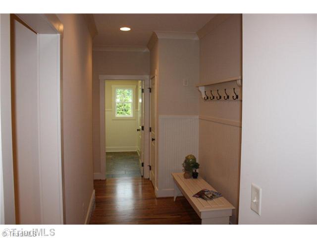 8906 West Pepper Court Oak Ridge, NC 27310 - Photo 7 of 16 Other. This drop zone is located directly off of the garage. There is a bench, shelf with hooks and an outlet for charging cell phones. One of the two first floor coat closets and the laundry are conveniently located nearby.