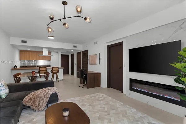 a living room with furniture and a flat screen tv