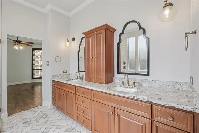 a bathroom with a double vanity sink and a mirror