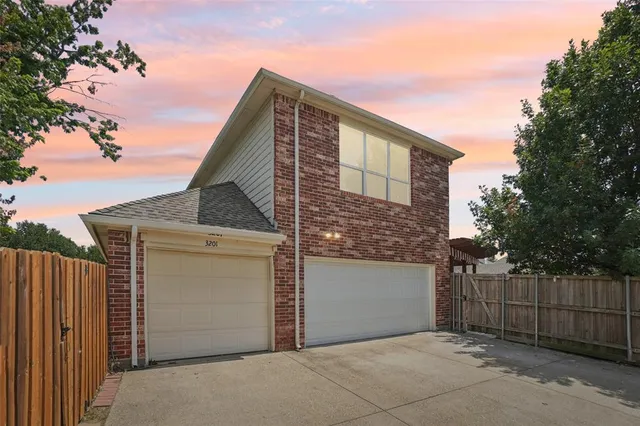 an aerial view of a house with swimming pool