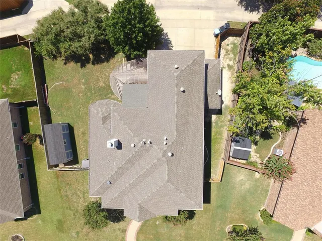 a view of a house with a yard and sitting area