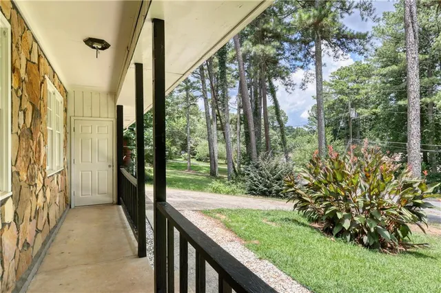 a view of balcony with yard