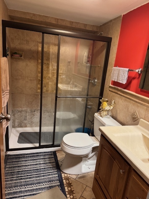 300 South Roselle Road, Unit 207 Schaumburg, IL 60193 - Photo 11 of 13 a bathroom with a sink toilet and shower