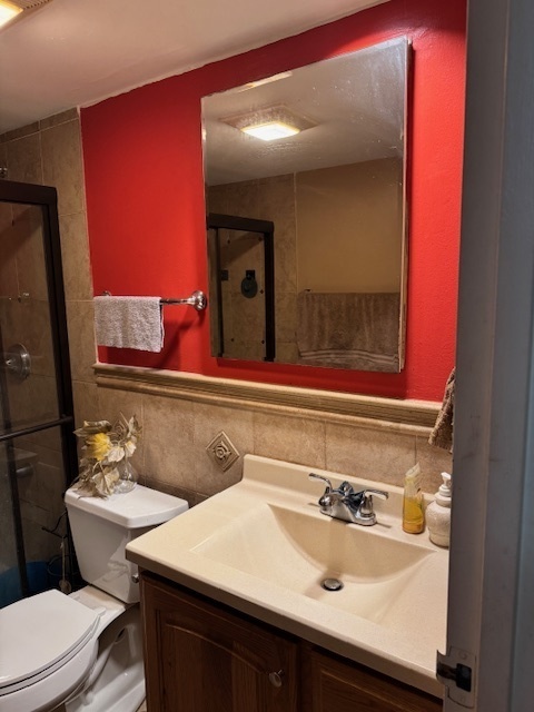 300 South Roselle Road, Unit 207 Schaumburg, IL 60193 - Photo 12 of 13 a bathroom with a sink and a mirror