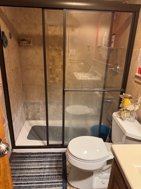 300 South Roselle Road, Unit 207 Schaumburg, IL 60193 - Photo 13 of 13 a bathroom with a toilet and a shower