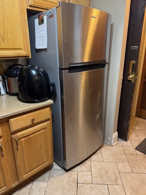 300 South Roselle Road, Unit 207 Schaumburg, IL 60193 - Photo 8 of 13 a close view of a refrigerator a stove and a microwave